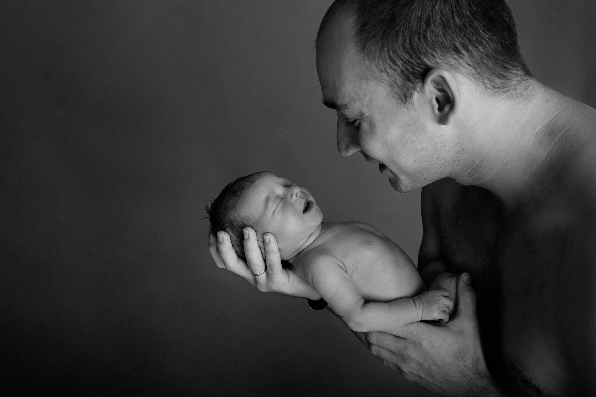 A father holding his newborn child